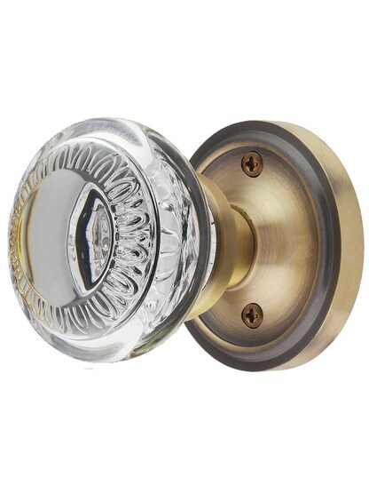 Classic Rosette Door Set with Ovolo Crystal-Glass Knobs in Antique Brass.